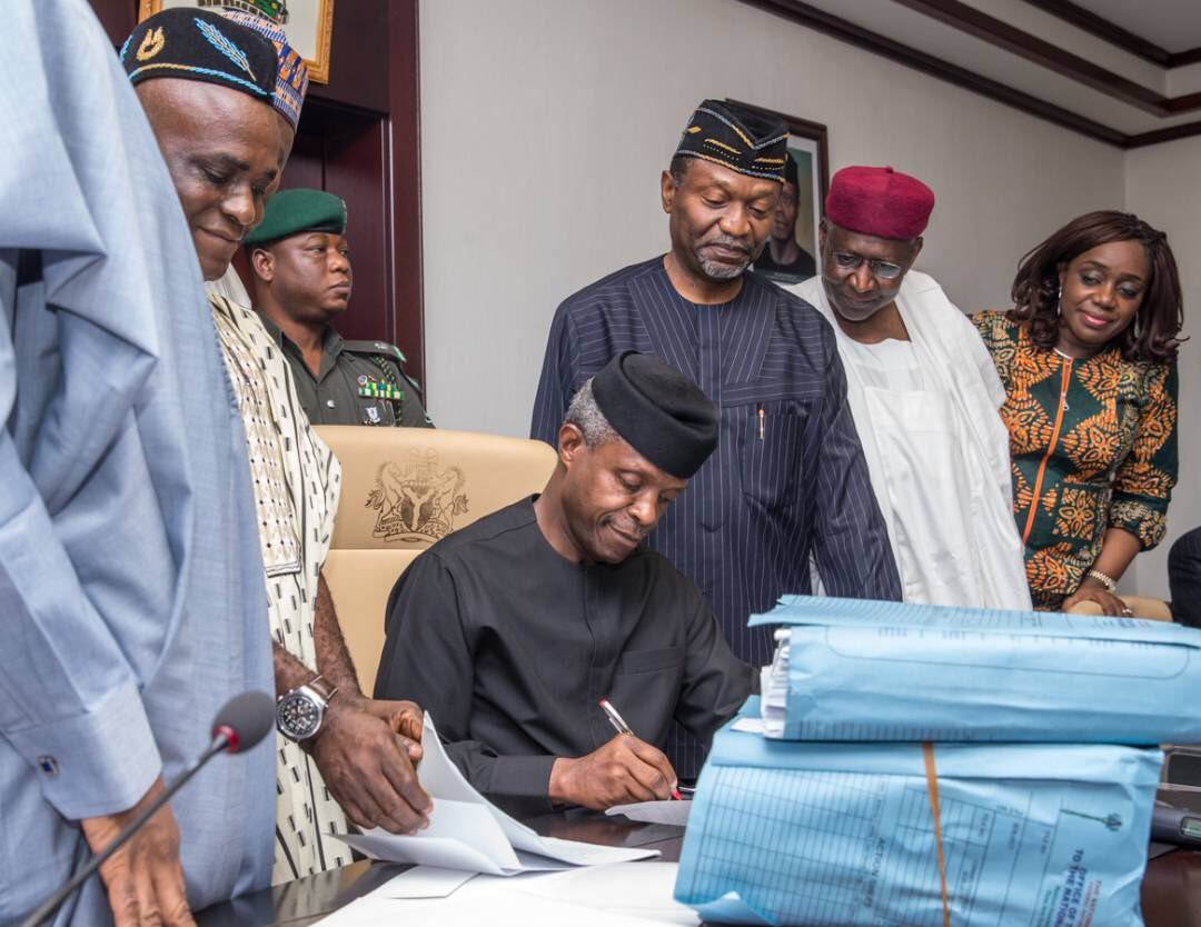 PHOTOS: Acting President Osinbajo Signs 2017 Budget Into ...