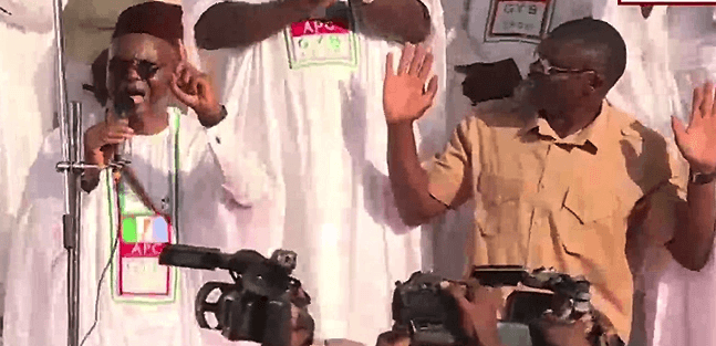 El-Rufai on his knees at a campaign rally in Kogi