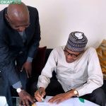 President Muhammadu Buhari signing the amended Deep Offshore Act