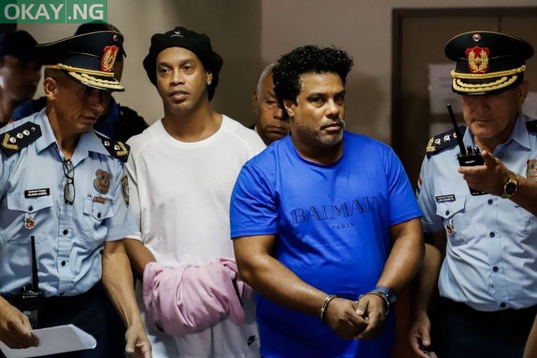 Ronaldinho in handcuffs after arrest