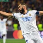 Real Madrid’s French forward Karim Benzema celebrates after Shakhtar Donetsk’s Ukrainian defender Serhiy Kryvtsov scored an own goal during the UEFA Champions League football match between Shakhtar Donetsk and Real Madrid at the Olympic Stadium in Kiev on October 19, 2021. (Photo by Sergei SUPINSKY / AFP)