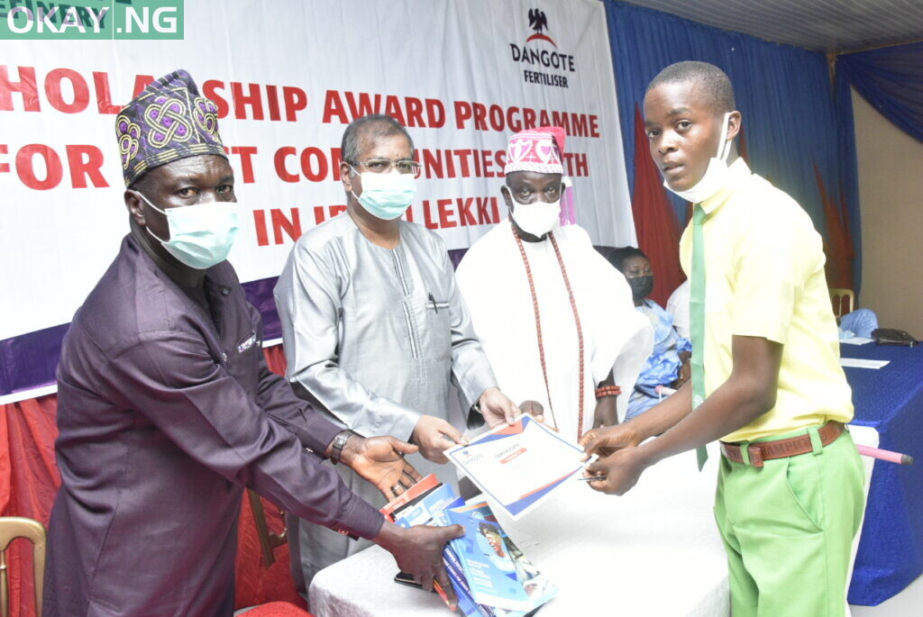 L-R, Abdulrahman Lekki Risho Yoyinsola, One of Beneficiary, Student of Lagos state University.   (LASU) Group Executive Director, Strategy, Capital Projects and Portfolio Development, Dangote Industries Limited, Devakumar Edwin, HRM, Oba Olumuyiwa Ogunbekun, Onilekki of Lekki Land,   at the Dangote Oil Refinery Projects and Fertilizer Limited,  Presentation of Scholarship Awards Programme for the Host Communities Youth in Ibeju -Lekki, Lagos on Monday 6th December 2021