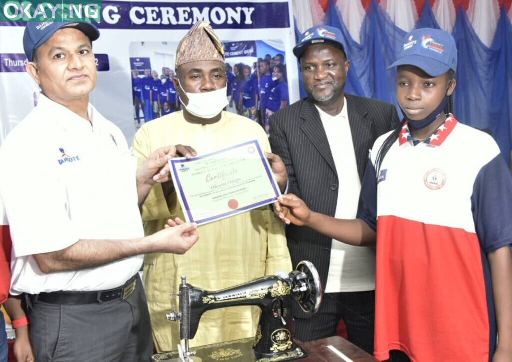 L-R; Dangote Cement PLC Ibese Plant Director, Azad Nawabuddin, Ogun state Commissioner for Community Development and Cooperatives, Ganiyu Hamzat, Dangote Cement PLC Ibese Plant, General Manager, Human Assets Manager/ Admin, Abu Sufyan, One of the Beneficiaries, Odeyemi Dolapo, receiving her Start -Up Pack and Certificate, During the Closing Ceremony of Dangote Cement Plc Ibese Plant, Host Communities Youths Skill Acquisition and Empowerment Program, held in Ibese Cement Plant Ogun state at the weekend.