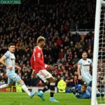 Manchester United’s English striker Marcus Rashford (C) scores the opening goal past a diving West Ham United’s French goalkeeper Alphonse Areola (R) during the English Premier League football match between Manchester United and West Ham United at Old Trafford in Manchester, north west England, on January 22, 2022. Oli SCARFF / AFP