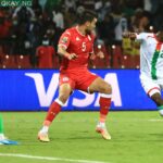 Burkina Faso’s forward Dango Ouattara (R) shoots to score his team’s first goal during the Africa Cup of Nations (CAN) 2021 quarter final football match between Burklina Faso and Tunisia at Stade Roumde Adjia in Garoua on January 29, 2022. Daniel BELOUMOU OLOMO / AFP