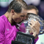 Spain’s Rafael Nadal kisses the Norman Brookes Challenge Cup trophy following his victory against Russia’s Daniil Medvedev in their men’s singles final match on day fourteen of the Australian Open tennis tournament in Melbourne on January 30, 2022. Martin KEEP / AFP