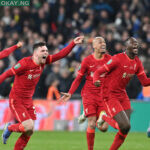 Liverpool players celebrate after seeing Chelsea’s Spanish goalkeeper Kepa Arrizabalaga hit his penalty over the bar in the shoot-out in the English League Cup final football match between Chelsea and Liverpool at Wembley Stadium, north-west London on February 27, 2022. Liverpool won the game 11-10 on penalties after the game finished 0-0 aet. JUSTIN TALLIS / AFP