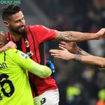 AC Milan’s French goalkeeper Mike Maignan (L), AC Milan’s French forward Olivier Giroud (C) and AC Milan’s Italian defender Alessio Romagnoli (R) celebrate their victory at the end of the Italian Serie A football match between Inter Milan and AC Milan at the Giuseppe-Meazza (San Siro) stadium in Milan on February 5, 2022. Isabella BONOTTO / AFP