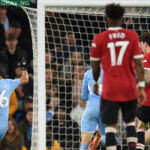 Manchester City’s Algerian midfielder Riyad Mahrez (L) shoots to score their fourth goal during the English Premier League football match between Manchester City and Manchester United at the Etihad Stadium in Manchester, north west England, on March 6, 2022. Manchester City won the game 4-1. Oli SCARFF / AFP