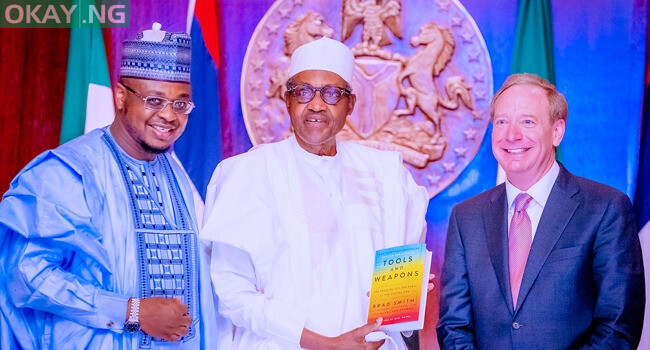 President Buhari receives a presentation from President and Executive Vice Chairman, Microsoft Corporation Brad Smith alongside Hon. Minister of Communication and Digital Economy Isa Ali Ibrahim Pantami during his audience with President of Microsoft Corporation in State House on 1st April 2022.