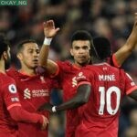 Liverpool’s Senegalese striker Sadio Mane celebrates with teammates after scoring his team third goal during the English Premier League football match between Liverpool and Manchester United at Anfield in Liverpool, northwest England on April 19, 2022. Oli SCARFF / AFP