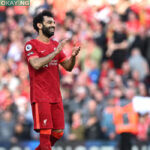 Liverpool’s Portuguese striker Diogo Jota (L), Liverpool’s Egyptian midfielder Mohamed Salah (C) and Liverpool’s English defender Trent Alexander-Arnold applauds the fans following the English Premier League football match between Liverpool and Everton at Anfield in Liverpool, north west England on April 24, 2022. Liverpool won the match 2-0. Paul ELLIS / AFP