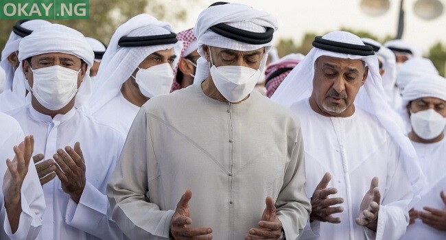 A handout picture released by UAE’s Ministry of Presidential Affairs shows Crown Prince of Abu Dhabi and Deputy Supreme Commander of the UAE Armed Forces Mohamed bin Zayed al-Nahyan (C) praying during the funeral of late UAE’s President Sheikh Khalifa bin Zayed Al-Nahyan during his funeral in Abu Dhabi on May 13, 2022. (Photo by Ministry of Presidential Affairs / AFP)