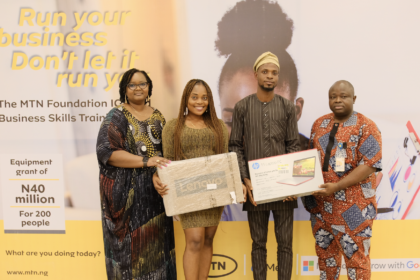 L-R; General Manager, Corporate Affairs, MTN Nigeria, Omasan Ogisi; Equipment grant recipients, Abisola Bakare and Abidoye Olaniyan, and Senior Manager, Regional Coordination, Network Group, MTN Nigeria, David Melaiye presenting the equipment grant to participants of the MTN Foundation ICT & Business Skills training at the MTN head office in Lagos State, on Friday 26, 2022.