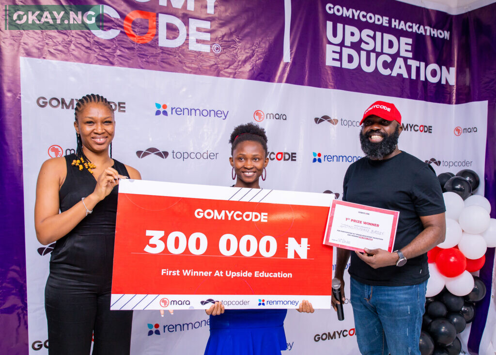 L-R: Rereloluwa Adetimehin, Brand Manager, Renmoney; Confidence Bassey, 1st Prize Winner, Upside Education Hackathon; Babatunde Olaifa, General Manager, GOMYCODE Nigeria at the first ever multi country hackathon that held recently in Lagos, Nigeria.