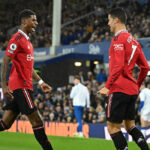 Manchester United’s Portuguese striker Cristiano Ronaldo (R) celebrates scoring his team’s second goal with Manchester United’s English striker Marcus Rashford (L) during the English Premier League football match between Everton and Manchester United at Goodison Park in Liverpool, north west England on October 9, 2022. (Photo by Oli SCARFF / AFP)