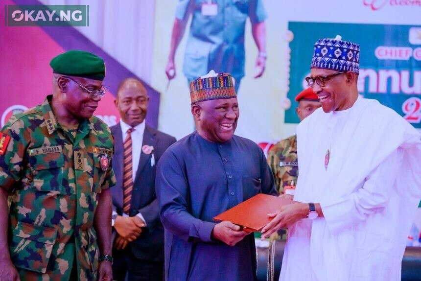 President Muhammadu Buhari, presenting the 2022 Nigerian Army Recognition Award to Abdul Samad Rabiu, Founder and Chairman, BUA Group while Lieutenant General Faruk Yahaya, the Chief of Army Staff looks on during the 2022 Chief of Army Staff Conference in Sokoto State, North West Nigeria