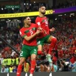 Morocco players celebrate their goal against Portugal.