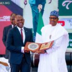 President Muhammadu Buhari, presenting the 2022 Nigerian Army Recognition Award to Tony O. Elumelu, the Chairman of Heirs Holdings, United Bank for Africa Plc and Transcorp Nigeria Plc