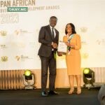 Mrs. Kanayo Awani, Executive Vice President of Afrexim Bank, presenting the *Financial Institution of the Year* award won by First Bank of Nigeria Limited to Victor Yaw Asante, MD of FBNBank Ghana representing CEO, FirstBank Group at the Afreximbank Pan African Business and Development Awards 2023 in Accra Ghana.