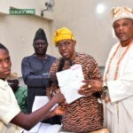 L-R, Abiodun Michael Oluwasegun , Student of Abusi Odumare Secondary school, Ijebu - Igbo, Receiving his Scholarship Award cheque from, Pastor Joseph Alabi, General manager Community Relation, Dangote Project; Ebenezer Fola Ali, Director Human Assets Management, Dangote Projects and Oba ( Dr.) Mufutau Adesesan Yusuf, Sopen Ilukale of Oke Sopen Ijebu - Igbo Ogun state, at the Dangote Granite Mines' Presentation of Students Scholarship Awards to Hosting Communities in Ijebu - Igbo Ogun state, at the weekend.