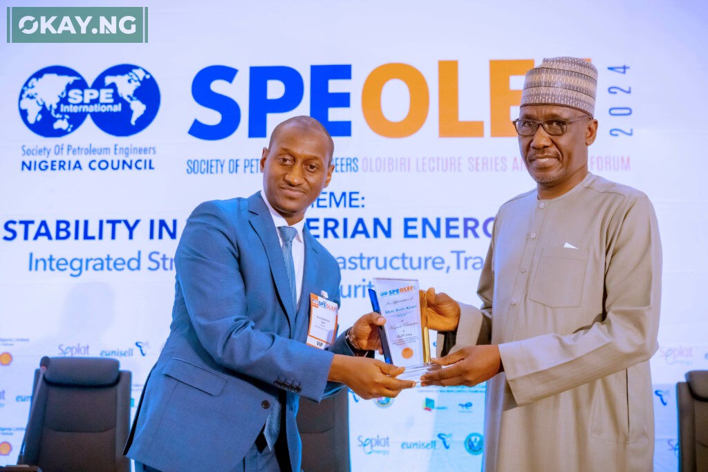 Group CEO, NNPC Ltd., Mr. Mele Kyari receives a plaque in appreciation of his role as the Keynote Speaker during the 2024 edition of Society of Petroleum Engineers Oloibiri Lecture Series and Energy Forum (SPE OLEF) held in Abuja, on Thursday.