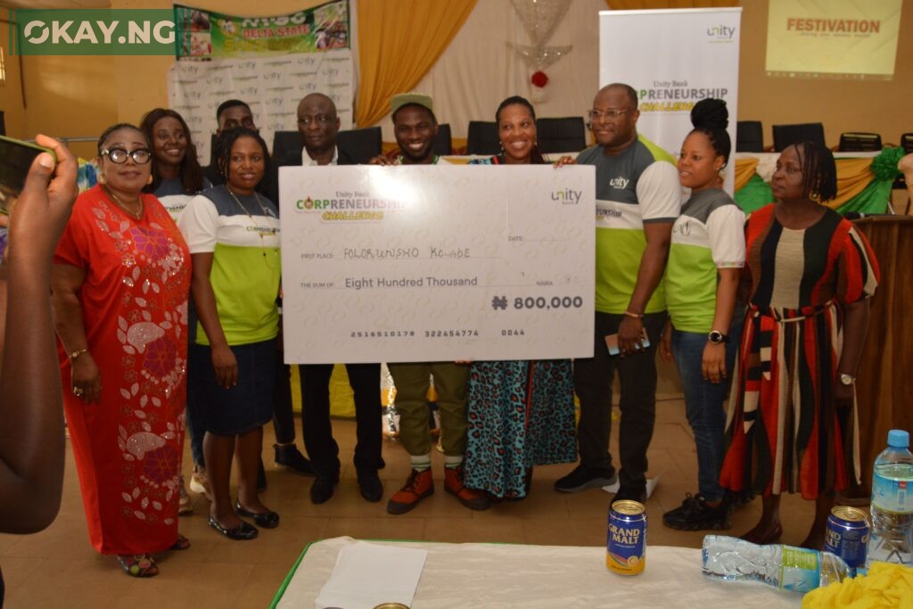 One of the winners at Delta NYSC Camp with some members of the Unity Bank team